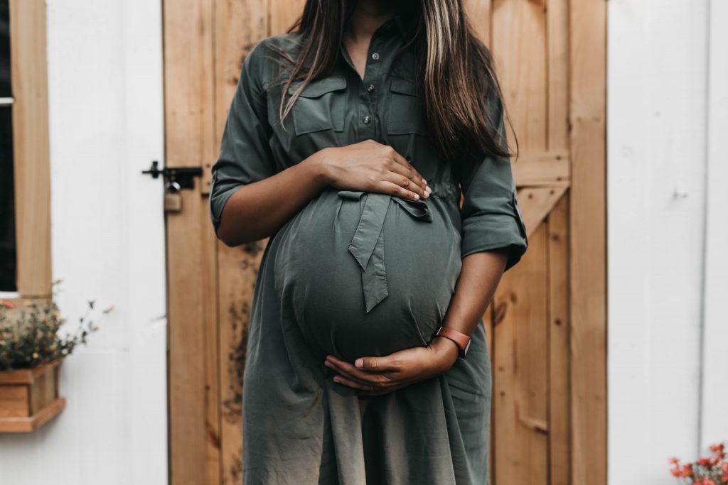 Image of Pregnant Female in a Dress